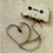 A split-screen image with a beige textured background on the left and solid purple on the right, featuring pixelated text and a heart-shaped drawing.