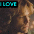 A pixelated image of a person with light brown hair and a dark background, featuring cyan text reading "I LOVE" on the left side.
