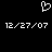 A black background displays a white pixelated heart symbol above two identical date strings in white pixelated text.