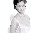 Static pixelated image of a person with short dark hair and light skin, cropped to show upper body against white background.