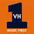 A static orange background displays a large dark blue number '1' with 'VH' text inside, 'MUSIC FIRST' below it, and 'The Music and Shows' and 'That We Want' text blocks on the right.