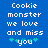 Blue background with white pixelated text reading 'Cookie monster we love and miss you' and two green plus signs on each side of 'you'.