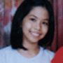 A young person with shoulder-length black hair wears a light gray shirt, smiling in a of four with varying background colors and cropping