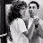 A 48x48 pixel animated contact sheet with two visible frames showing a black-and-white image of two people dancing and text reading "definitely have to dance on my date" above the name "Rainman" in a stylized font.