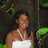 A pixelated image of a woman in a white halter dress standing among green foliage, with blue text reading "My Beautiful Princess Jasmine!" on the right side.