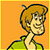 Pixelated cartoon character with orange hair and green jacket on orange background next to green text 'Original Icons .com' on dark green background