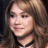 A 48x48 pixel buddy icon split into two sections: a left-side portrait of a person with long brown hair and a black choker necklace, and a right-side green background with bright green text reading "Original Icons .com" in stylized font.