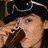 A person wearing a black hat with goggles and holding chopsticks over a plate of waffles, next to red background with cyan text.
