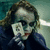 A pixelated image of a character with disheveled hair holding a playing card, with text appearing sequentially across black