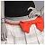 Pixelated static image of a figure with black hair and red bow tie against light background.