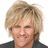 Static pixelated image of a person with light brown tousled hair, wearing dark clothing against white background.