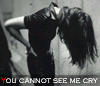 A black-and-white animated contact sheet showing a woman in a dark dress leaning forward with long hair obscuring her face, accompanied by repeated text "YOU CANNOT SEE ME CRY" at the bottom of each frame.