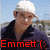 Pixelated image of a person wearing white cap and dark jacket with red text 'Emmett:' at bottom.
