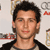 Static 50x50 pixel buddy icon showing a close-up of a person's face with dark hair and light skin, wearing a black jacket over a light shirt against a neutral background.