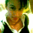 Pixelated image of a person with light brown hair and a black top, next to purple background with partial text.