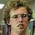 A pixelated contact sheet showing two frames of an animated icon featuring a character from Napoleon Dynamite and pink text reading "One Sexy Beast" on the right side.