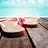 Pixelated beach scene with two women in bikinis on lounge chairs under a blue sky, green text overlay reading "Flip Flop It Like Izzy Hodge!".
