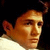 Pixelated split-frame image showing a person's face on the left and "ONE TREE HILL" text on the right against a yellow background.