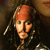 A pixelated image of a person with long dark hair and a red bandana, overlaid with text reading 'A Pirate's life for me...' in multiple positions.