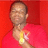 Pixelated image of a person in red clothing with yellow and white chest markings against solid red background.
