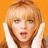 A pixelated image of a person with light brown hair holding both hands to their head against an orange background, next to text reading "Teenage Drama Queen" on a beige backdrop.