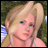 Pixelated image of a blonde woman with blue eyes and light skin, wearing a sleeveless top against green foliage background.