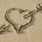 A pixelated heart shape formed by a dark brown outline on a light beige background, with a small curved line inside the heart.