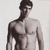 A pixelated grayscale image of a shirtless man with short dark hair, shown in two side-by-side frames where the right frame displays "USA" text overlay.