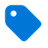 A blue tag-shaped icon with a white circular hole near the top left corner, set against a light gray background.