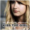 A static image of a person with long blonde hair and red lips, with text reading KISS THE GIRL overlaid at the bottom.