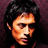 A pixelated image of a person with dark hair against a maroon background, paired with red text reading 'Sing To Mall' on white.