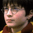 Pixelated image of a young person with dark hair and glasses on a bright pink background with blue text.