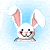 Pixelated bunny head with pink inner ears, black eyes, and a smiling mouth against light blue background.
