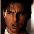 A pixelated image of a person with dark hair and light skin, wearing a white shirt against a green background with bright green text.