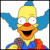 Pixelated cartoon character with yellow hair, blue ears, red nose, orange face, and open mouth smiling against white background.