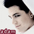 A pixelated close-up of a person with dark hair and light skin, wearing a white head covering, with red text below.
