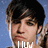 A pixelated image of a person with dark hair and a blue background, featuring overlaid text in a blocky font.