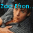 A pixelated image of a person in a gray shirt with text overlays, showing two distinct states: one with 'Zac Efron.. married to' and another with 'me bitch'.