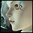 Pixelated anime-style character face with light blue hair and red eyes, next to black background with white text reading 'AnimeIM' and 'com'