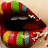 Colorful striped lips with scattered sprinkles, animated to open and close against a light background.