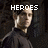 Pixelated image of a person in dark clothing with text above the head, showing two states of text change.