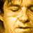 A static digital image featuring a person's face, red text reading 'SMOKIN' ACES', and repeated name text in red.