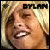 Pixelated close-up of a person's face with light brown hair, mouth open showing teeth and tongue, against a beige background with black text reading 'BYLAM' at top.
