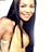 Static 48x48 pixel icon of a woman with long dark hair wearing a light-colored sleeveless top, smiling at the viewer.