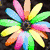 Colorful pixelated icons arranged in a : a rainbow flower, blue roses, white wings with a star, and a yellow crescent with green swirls