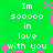 Green background with white and pink pixelated text reading "Im soooooo in love with you" arranged in a pattern, surrounded by decorative asterisks and dashed lines