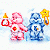 A 50x50 pixel animated buddy icon featuring two Care Bear characters holding torches against a white background, with "OriginalIcons.com" text on the right side of the contact sheet.