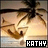 Animated icon shows a stylized face with closed eyes and palm trees against a sunset sky, text 'KATHY' in black box at bottom left.