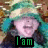 A person wearing a green and white hooded garment with a blurred background, displaying sequential text overlays.