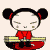 A cartoon character with black hair in two buns, red clothing, and closed eyes appears in multiple poses holding a yellow rectangular object on a red circular base.